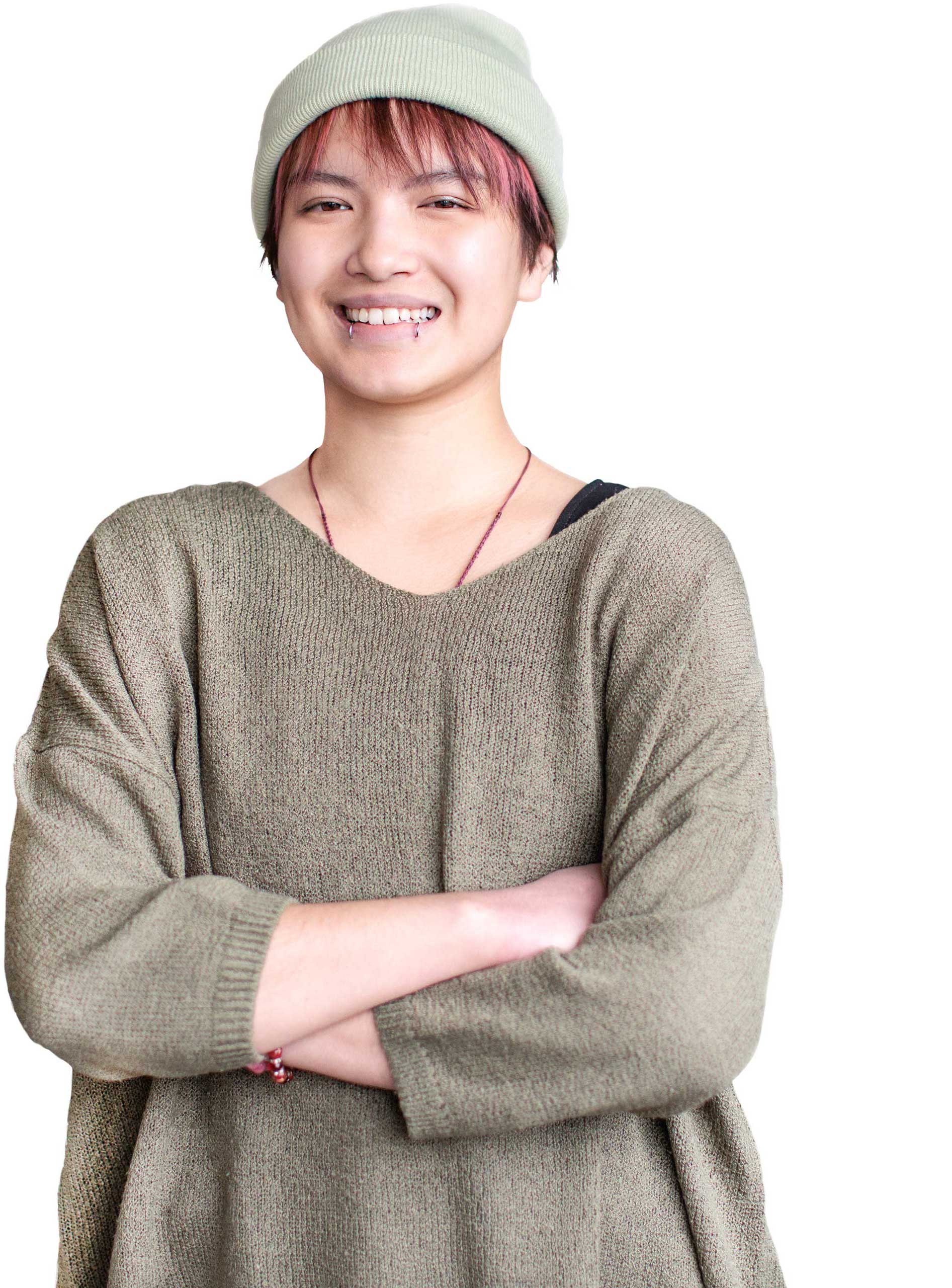 Young asian woman smiling at the camera having found a sober living arrangement.